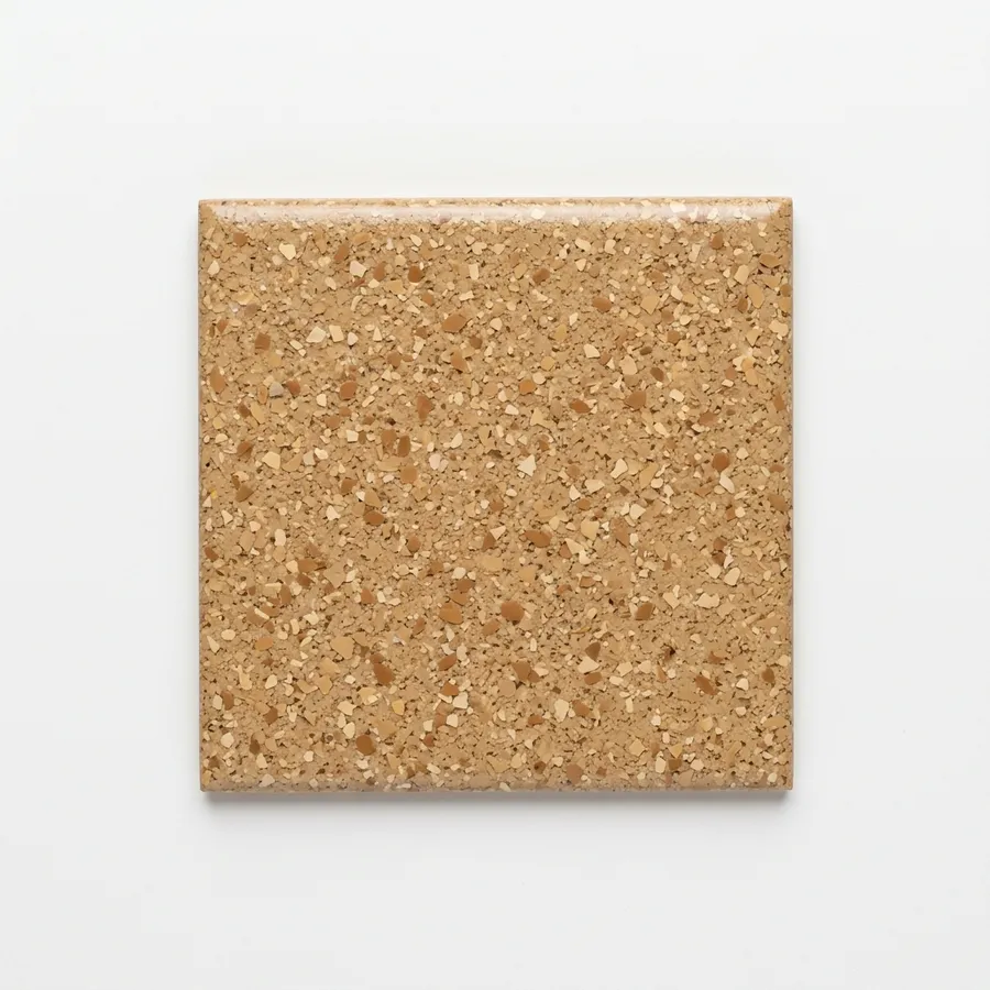 Warm tan polyaspartic coating swatch with sand and caramel flake